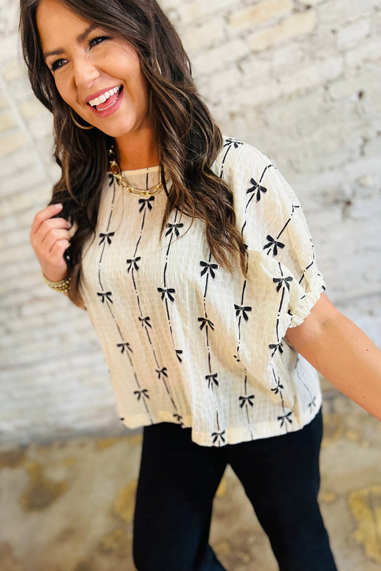 Bella Love Boutique California LLC Tops/Blouses & Shirts Beige Bow Print Puff Short Sleeve Top