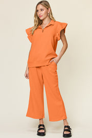 Trendsi Outfit Sets Tangerine / S Double Take Texture Ruffle Short Sleeve Top and Drawstring Wide Leg Pants Set